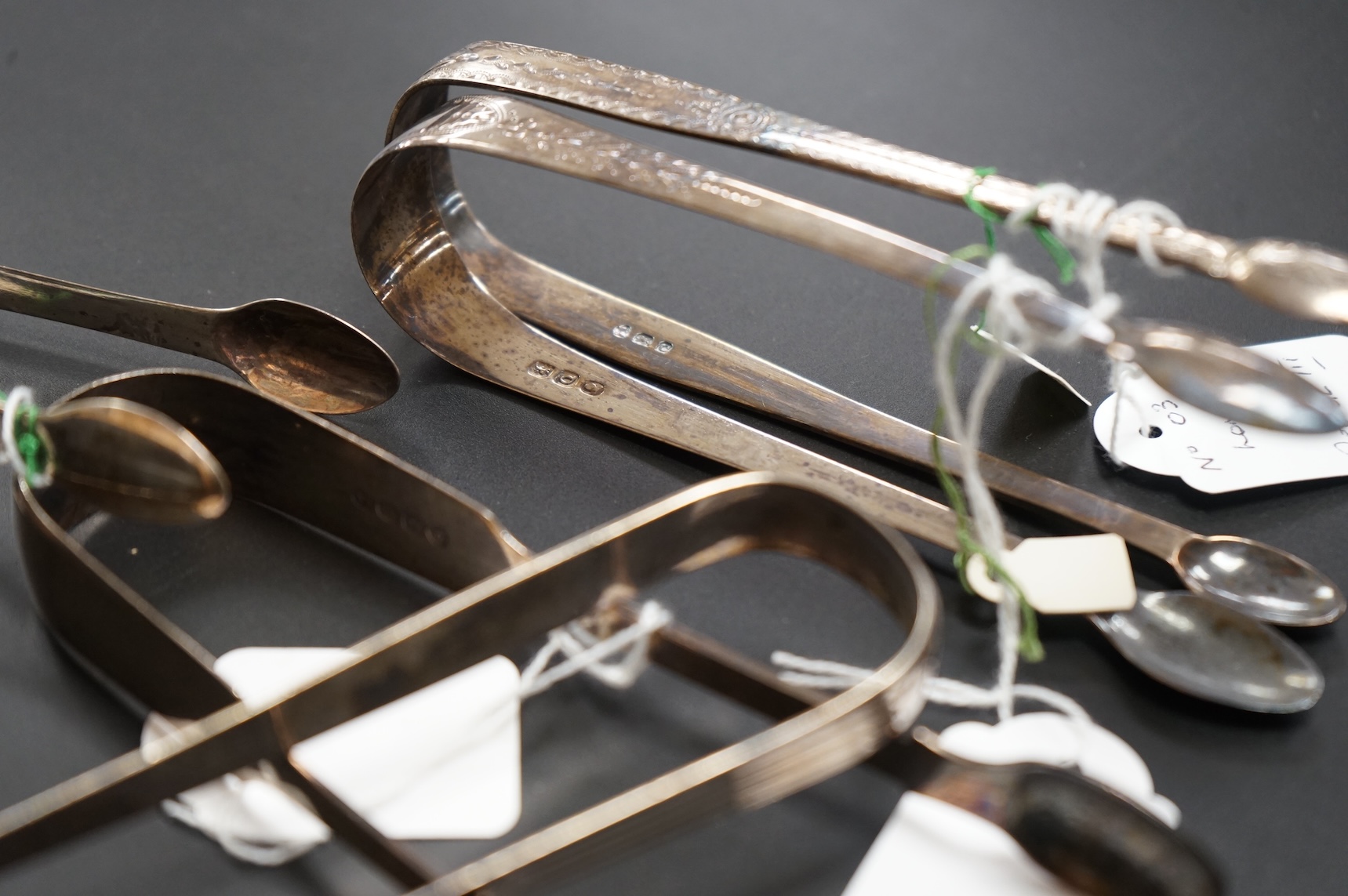 Five assorted pairs of Georgian silver sugar tongs, including four George III, one by Peter & Ann Bateman, London, 1797 largest 13.3cm.